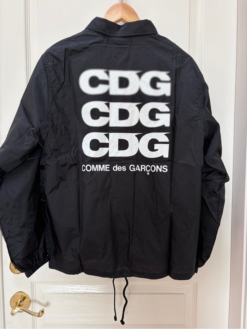 CDG black coach jacket
